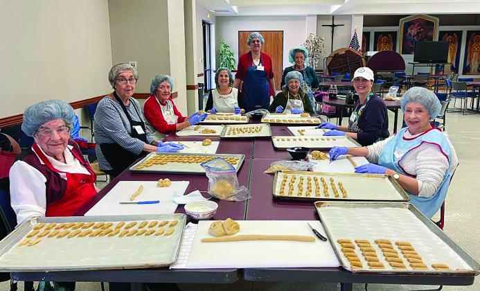 St. Joseph’s Day volunteers rolling biscotti: Mary Jo Cacioppo, Rose Ann Brocato, Ann Rothkamm, Stephanie Roberts, Diane Tweedie, Eleanor Means, Margaret Bood, Kate Jabbia and Carolyn Allen. Cacioppo, the event’s most senior volunteer at 92 years young, said that she has been making cookies for St. Joseph Altars since she was a child – taught by her mother and aunts.