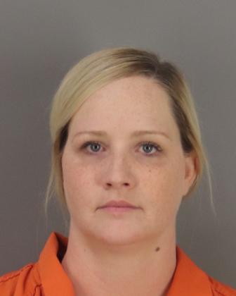 Mary G. Bond, 37, poses in a county mugshot June 6 for the second time in as many months