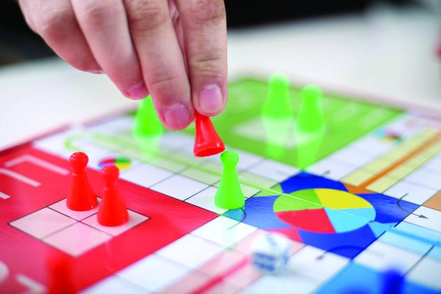 A person plays a board game 