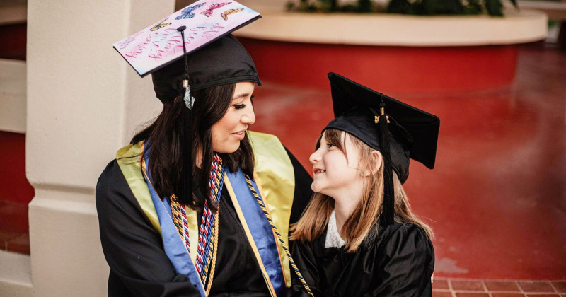 Local mom and LU graduate Brittney Losier celebrates graduation alongside daughter Adelyn.