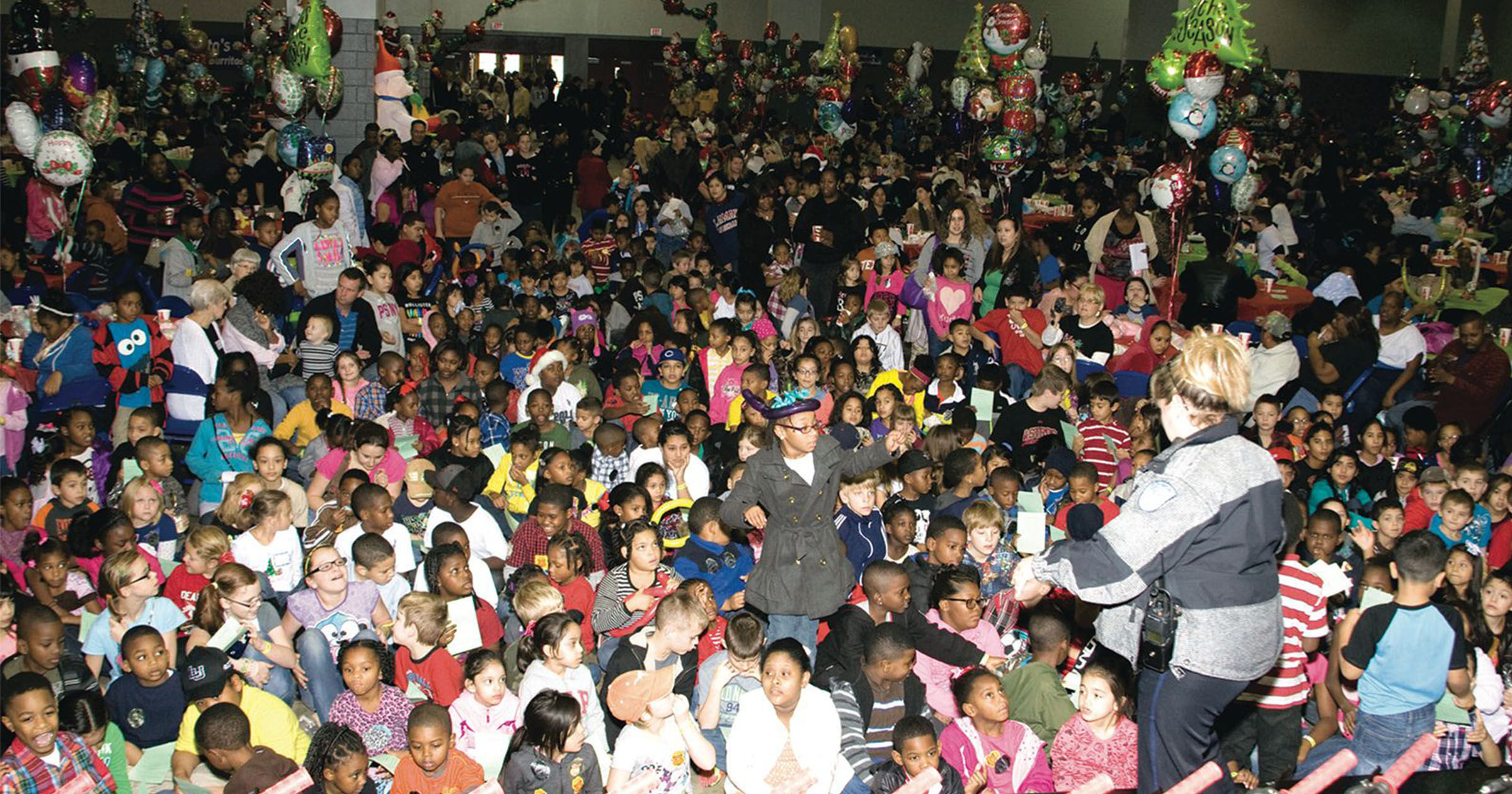 Reaud’s Bicycles and Bibles welcomes thousands into Ford Park in 2013. Ten years later, thousands more are treated to a gift-giving event that has evolved for the current climate.