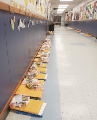 Education packets for students line the empty halls of Vidor Elementary.