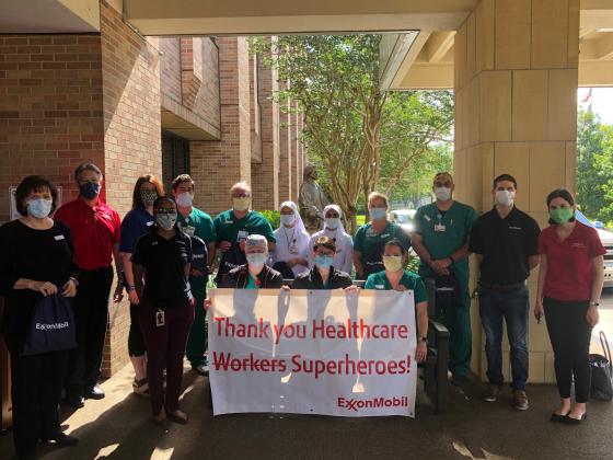 ExxonMobil representatives flank CHRISTUS employees