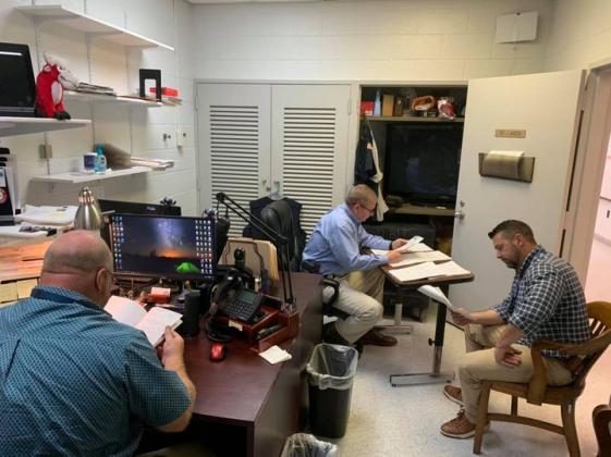 BPD detectives review cases. (From BPD)