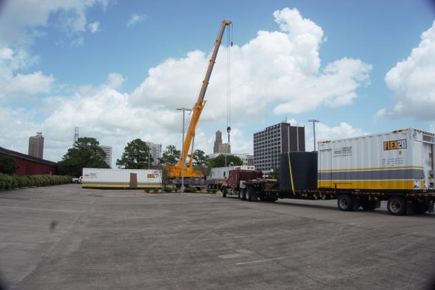 Temporary housing pods being placed in The Event Centre parking lot Monday afternoon.