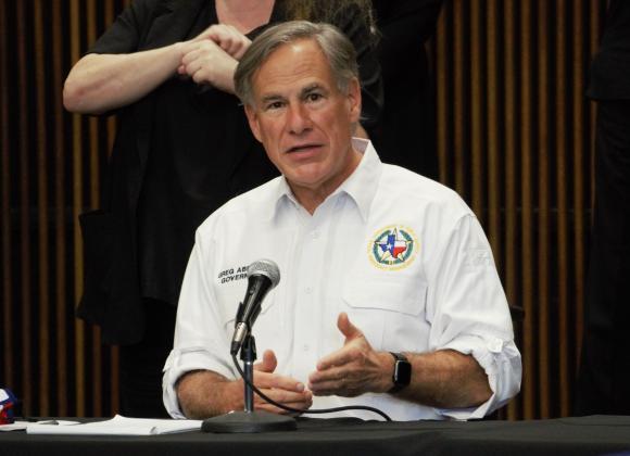 Governor Greg Abbott addresses Beaumont reporters in August