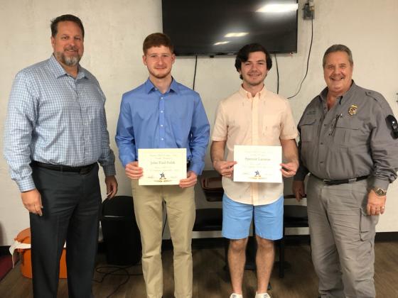 From left, Kiwanis President Shane Johns, John Paul Sulak, Spencer Layman, and Kiwanis Vice-President Harry Vine