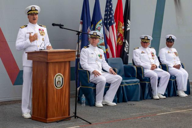 Photo By Petty Officer 2nd Class John Bellino | 210806-N-PC065-2144 ATLANTIC OCEAN (Aug. 6, 2021) Capt. Eric Kellum, commanding officer of San Antonio-class amphibious transport dock ship USS Arlington (LPD 24), gives a speech during a change of command ceremony on Arlington’s flight deck, Aug. 6, 2021. Kellum relieved Capt. Chris “Chowdah” Hill as the commanding officer of Arlington. (U.S. Navy photo by Mass Communication Specialist 2nd Class John Bellino)