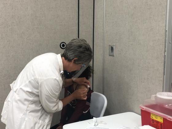 A Jasper County nurse administers the Pfizer vaccine 