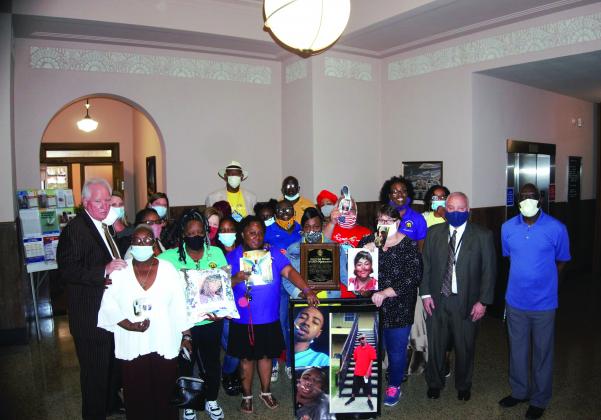 Members of Surviving Parents of SETX, along with Jefferson County District Attorney Bob Wortham pose for a photo after being honored