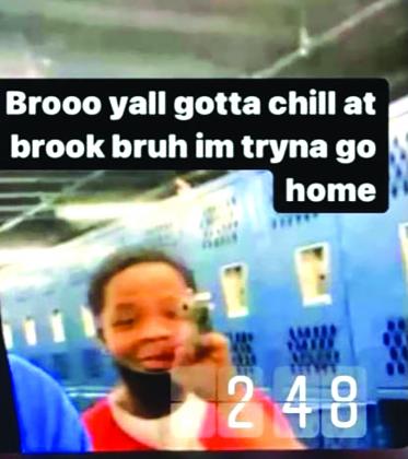 Screen capture of a tiktok where a student is shown holding a gun on the BISD campus. 