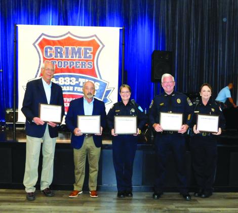Crime Stoppers of Southeast Texas honors Larry Beaulieu, Chief Jimmy Singletary, Officer Carol Riley, Chief Rod Carroll and Captain Crystal Holmes at the nonprofit's 40th anniversary awards ceremony.