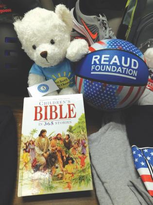 A teddy bear, basketball and children's Bible given out at Bicycles and Bibles