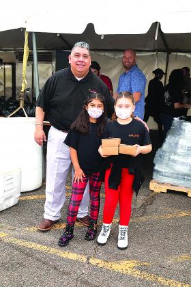 Carlos Hernandez, owner of Carlito's Mexican Restaurant provided breakfast burritos to families at Bikes and Bibles.