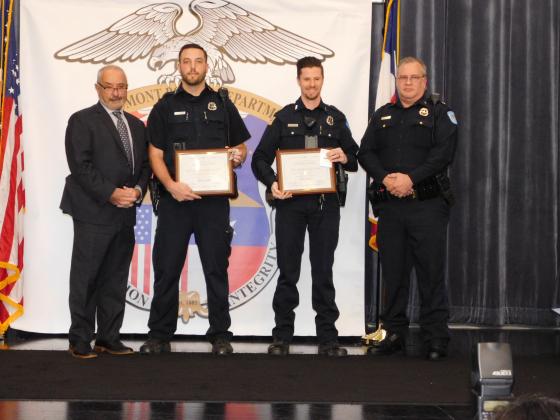Officers Zachary Guidry and Dominic Gradozzi receive lifesaving awards.