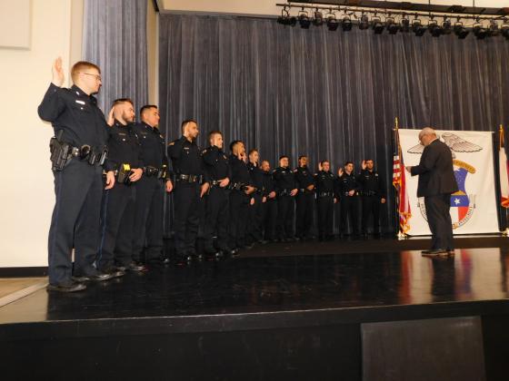 Chief James Singletary swears in 14 new officers, the largest number since 2012.