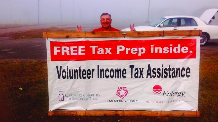 Jon Korejw holds a VITa banner that will be displayed in front of the Gloria Ramirez Neighborhood Resource Center on Gulf Street in Beaumont 