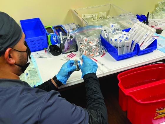 A nurse prepares a monoclonal antibody  treatment at the Regional Infusion Center