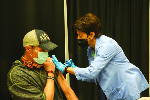 Port Arthur Health Department Director Judith Smith issues a COVID-19 vaccine in 2021