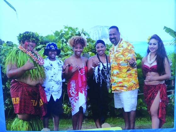 (From right to left) Kenneth Coleman Jr. (white shirt), Summer Coleman, Natosha Coleman and Kenneth Coleman are flanked by greeters in Hawaii.
