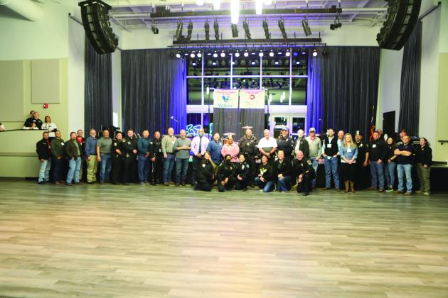 A group photo of many of the attendees.