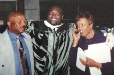  Joe Evans Sr., Joe Evans Jr. and Betty Evans pose after Joe’s graduation