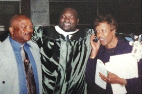 Joe Evans Sr., Joe Evans Jr. and Betty Evans pose after Joe’s graduation