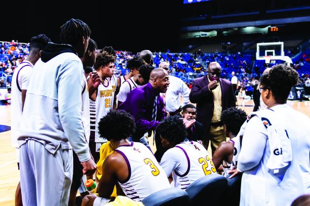 Players listen while a coach speaks