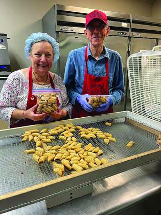 Linda and Joe Domino show off bags of fig cookies sure to be sold by March 18 if this year is anything like past years 