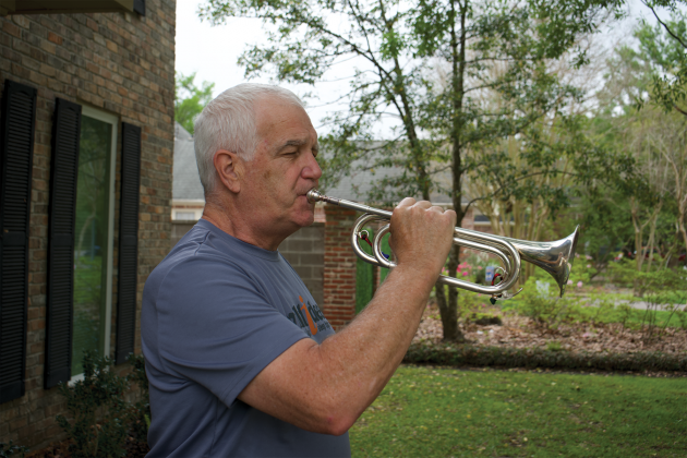 Donald Root plays a bugle donated by a family specifically for his Wounded Warrior Project effort. Those who wish to donate to the Wounded Warrior Project through Root’s cause may scan the QR code and  follow the link