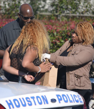 Supervisory Special Agent Nicole Sinegar, pictured here before her promotion, arrests a woman during her stint in the Houston Field Office working in the human trafficking squad.