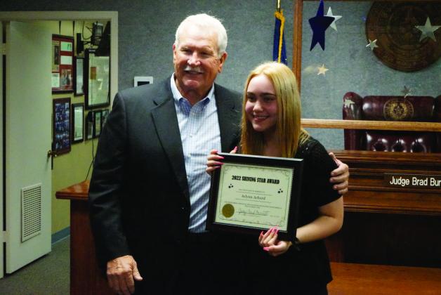 Justice of the Peace Precinct 7 Judge Brad Burnett poses with PNGHS senior Aslynn Achord, the 19th-annual recipient of the 'Shining Star' award.
