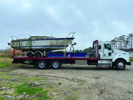 A vessel loaded onto a truck for disposal 