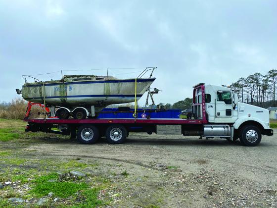 A vessel loaded onto a truck for disposal