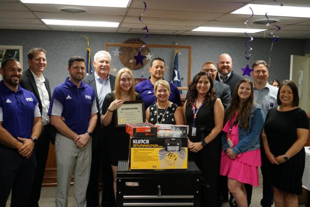 Judge Brad Burnett and Aslynn Achord pose with PNGHS staff and administrators at the 'Shining Star' ceremony May 18.