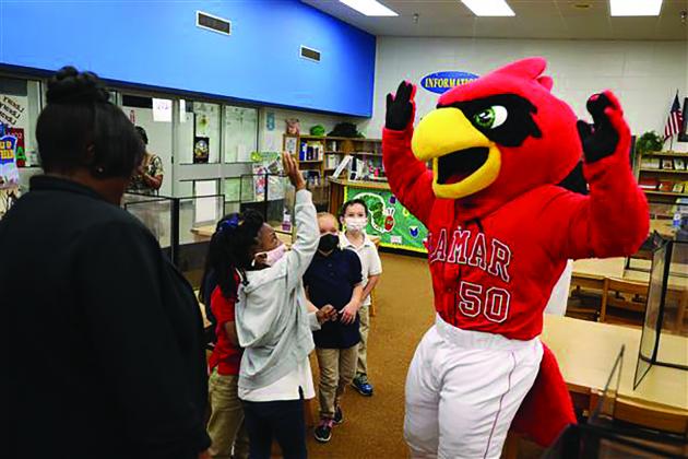 Big Red mascot in the Cardinal NEST with students 
