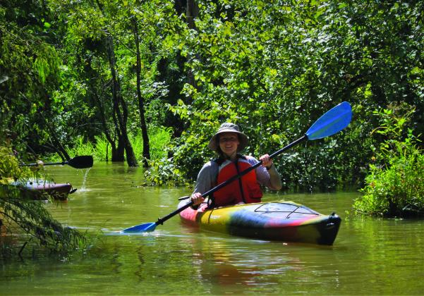 Someone canoeing on the waters of the Big Thicket National Preserve 