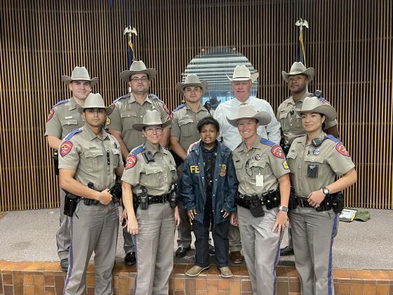 DJ poses with Texas DPS State Troopers