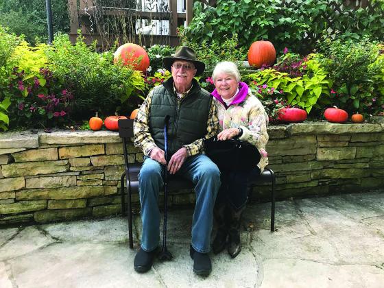 Ernie and Betty sit outside