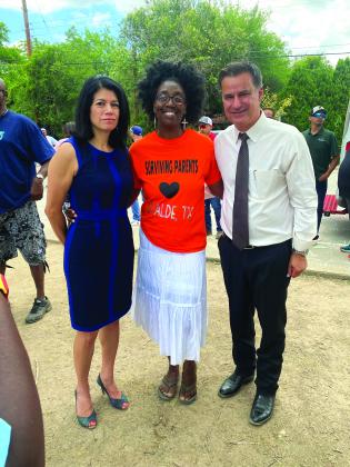 Demetricia Holloway, center, visits with parents and families of Uvalde school shooting victims, sharing comfort in sorrow she knows all too well.