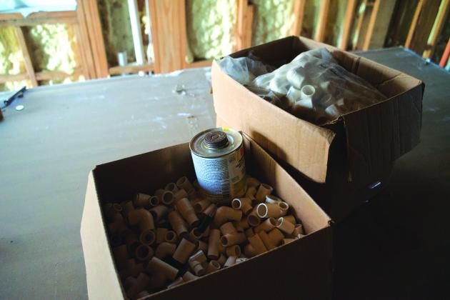 All manner of supplies and tools are left at the construction site, which has remained devoid of workers for months of observation by The Examiner