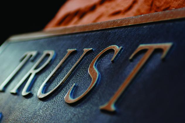 A sign that says the word "trust"