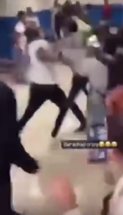  Students begin swinging fists after a teen throws a trash can at two others.