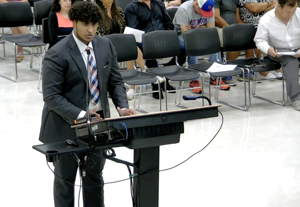 West Brook junior Saifan Panjwani speaks before district officials.
