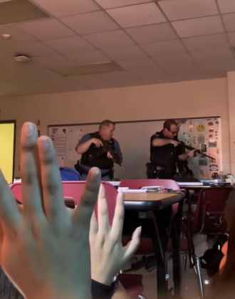 BPD officers tell students to put their hands up as they check the classroom for a gunman 