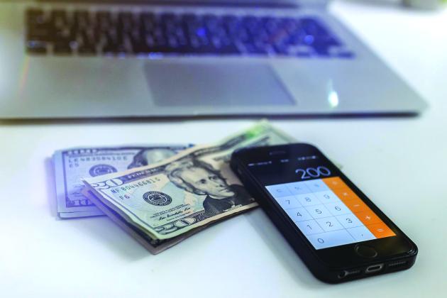 a photo of money with a phone