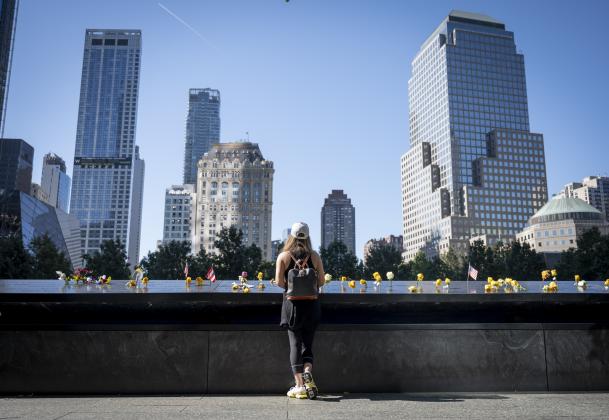 A visitor stands at the 9/11 memorial 