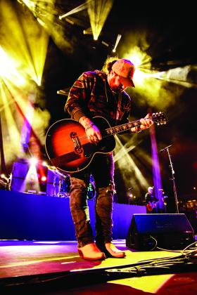 Koe playing guitar