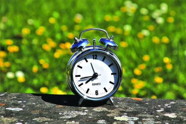 A clock sitting outside