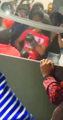 A teen boxes in a bathroom bout.